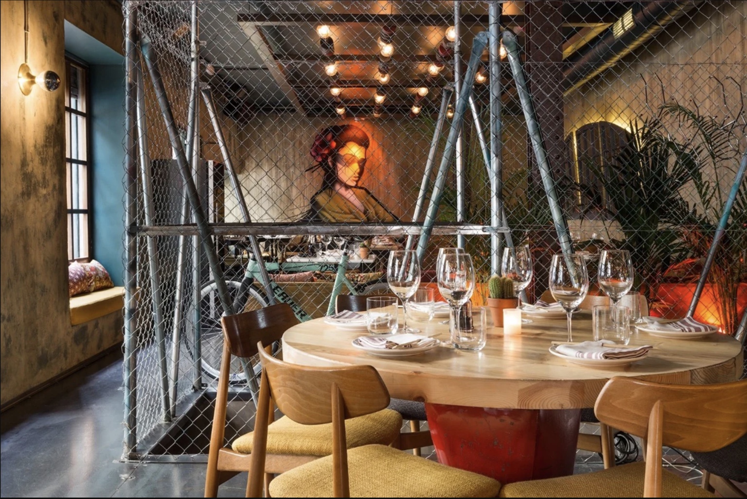 A restaurant interior designed by Genuine & Unique, with the table conceived as part of the space