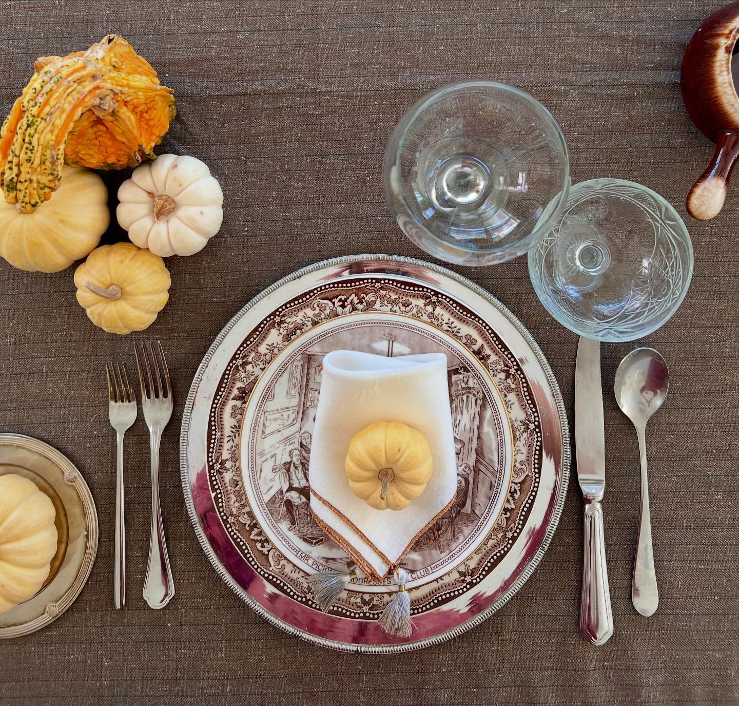A Thanksgiving table styled by Genuine & Unique with transferware, linen and miniature pumpkins